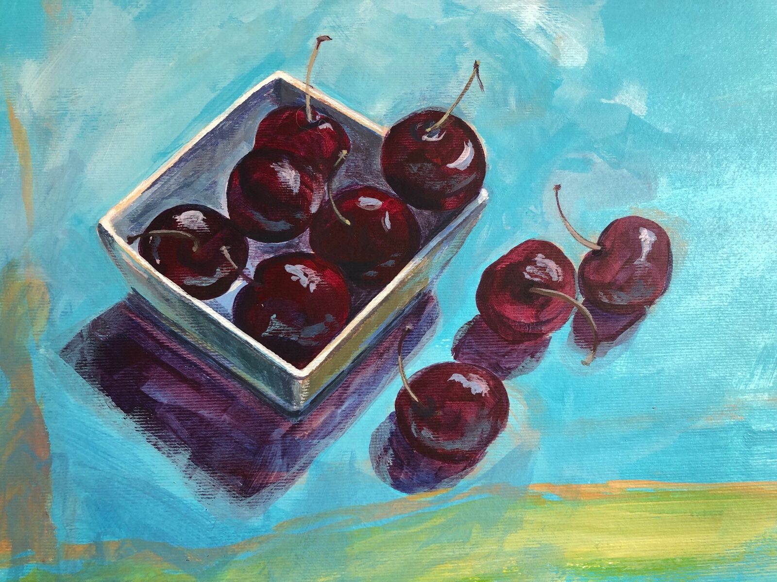 Black cherries in white dish