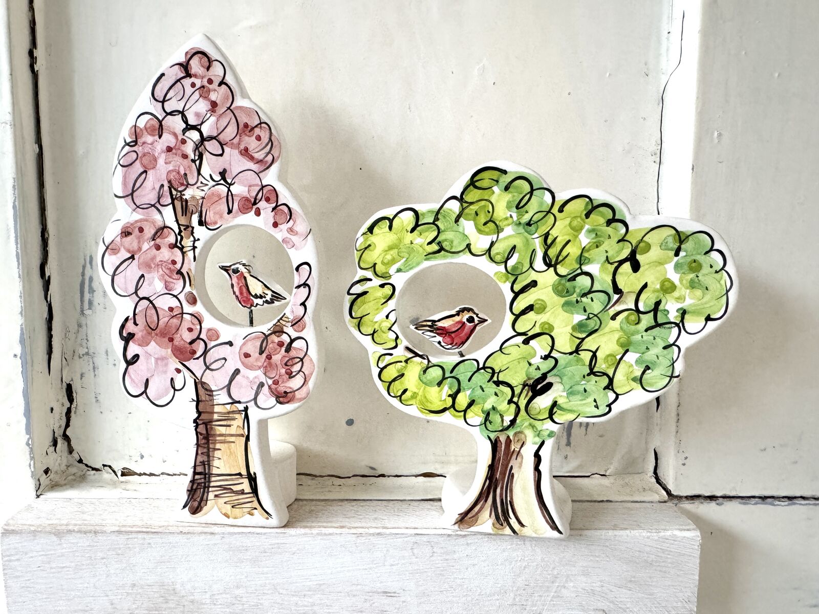 Green and blossom trees with robins