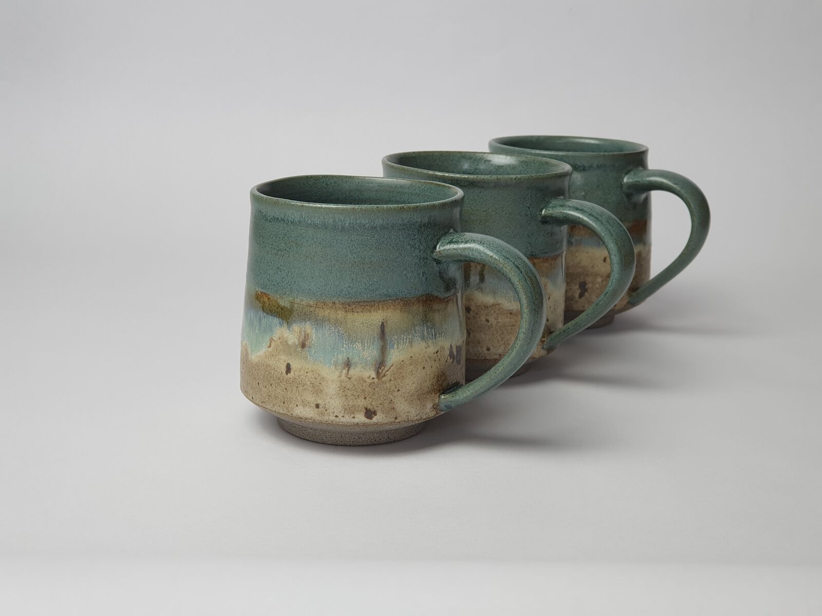 Ceramic coastal shoreline mugs