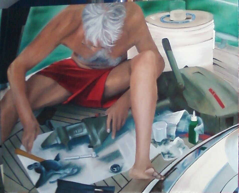 John mending the outboard