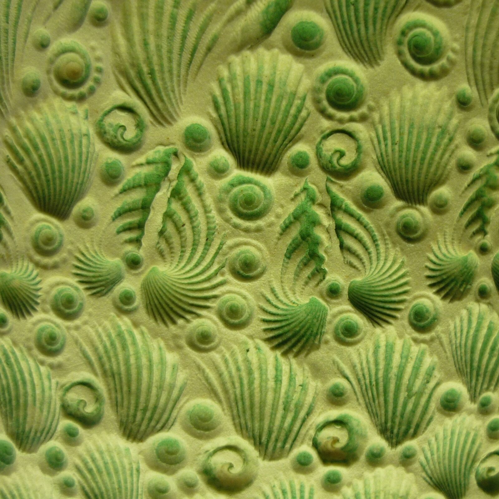 Sea Shell pattern on porcelain stoneware with green underglaze and opaque overglaze